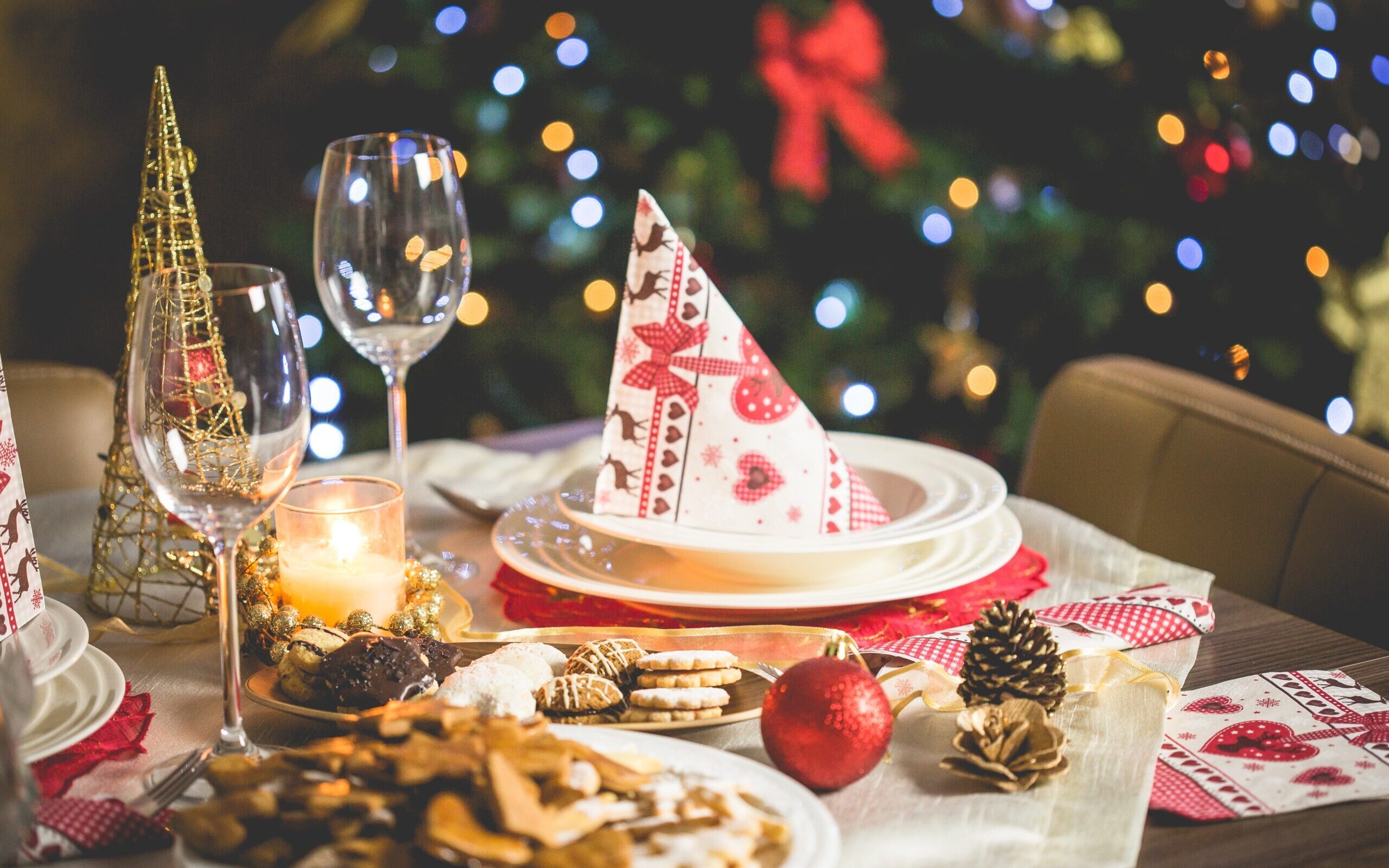 a table prepared for christmas dinner