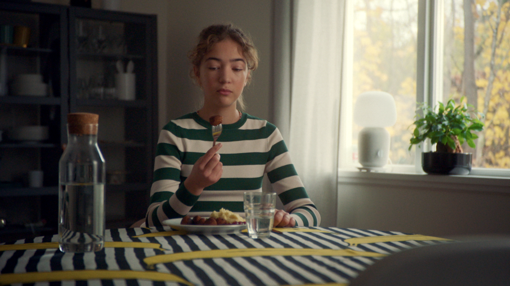 woman contemplating a meatball - taste the future