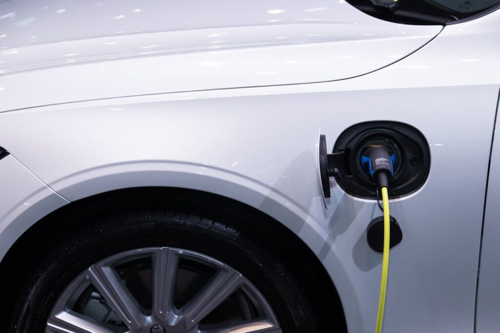A side-by-side view of the kia niro ev vs tesla model y, showcasing each electric SUV’s sleek design and eco-friendly appeal.