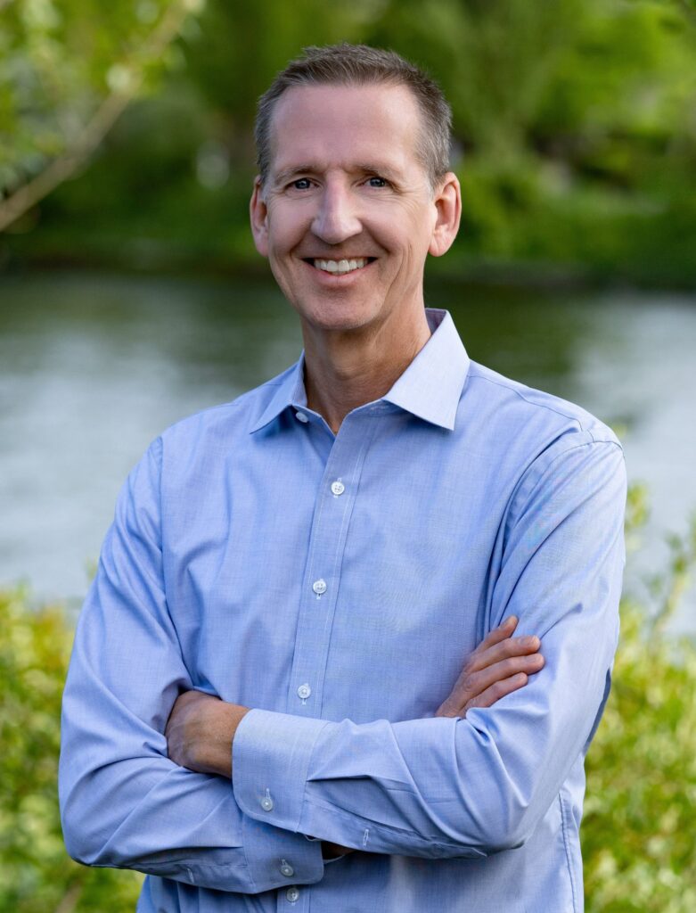 Leo Raudys, CEO of Call2Recycle, leader in the consumer battery recycling program, smiling outdoors with a natural background.