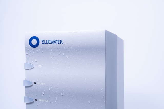 Close-up of a Bluewater reverse osmosis system with water droplets, representing one of the 5 methods of water purification.