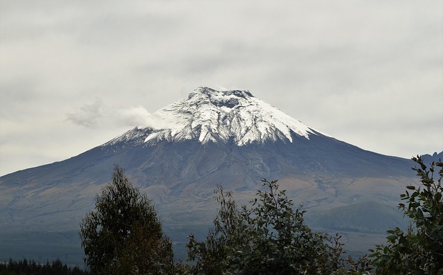 Snow-capped Cotopaxi volcano in the Andes, known for its breathtaking scenery, outdoor adventure, and significance to local culture and conservation.