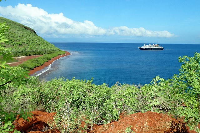 View of a cruise ship near Rábida Island in the Galápagos Islands—an iconic destination for ecotourism Ecuador focused on conservation and biodiversity.