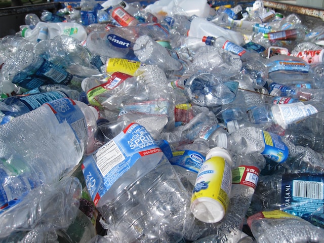 A large pile of discarded plastic bottles, highlighting the urgent need to break free from plastic and reduce single-use plastic waste globally.