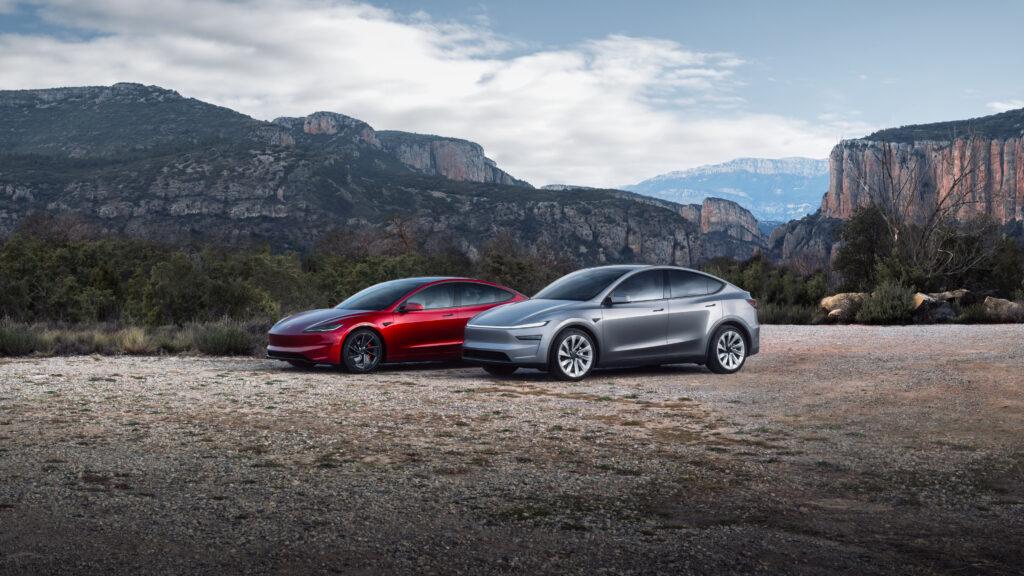 A red Tesla sedan and a silver Tesla SUV parked against a breathtaking mountain backdrop, both featuring sleek finishes that showcase the superior shine and protection of the best ceramic coating for Tesla.