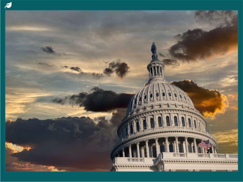 U.S. Capitol dome against a dramatic sunset sky as Senate Republicans tackle energy tax credits debate.