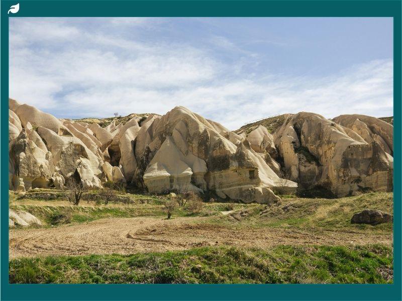 Geological rock formations with open land, representing carbon management through carbon capture and geological storage to reduce CO2 emissions and fight climate change.
