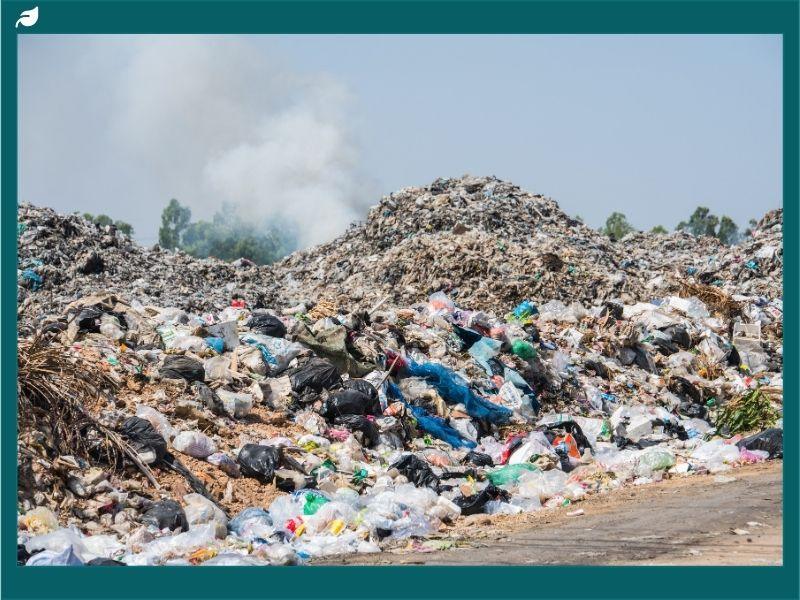 Large landfill filled with plastic bags and mixed waste, illustrating environmental challenges of dumpsites and the need for sustainable waste management solutions.