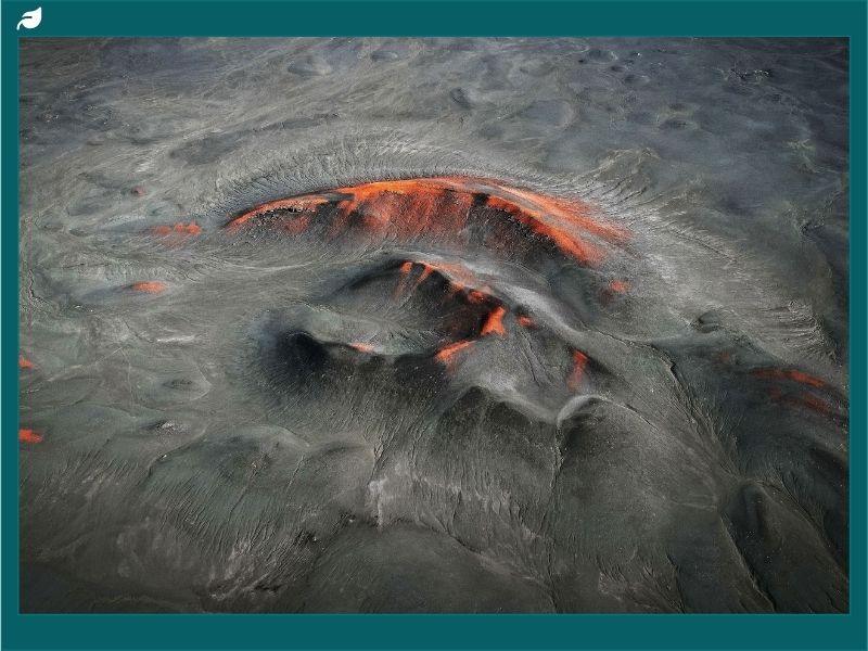 Close-up aerial view of an underwater volcanic vent near Vancouver Island glowing with molten lava, showcasing geothermal activity and newly formed volcanic eggs on the ocean floor.