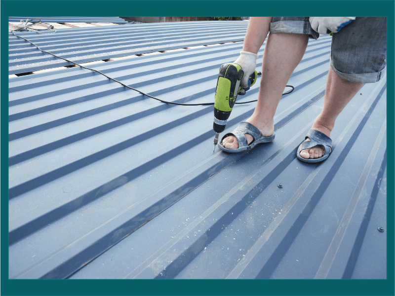 Solar panel technician inspecting rooftop solar panels, illustrating whether solar panels are worth it in the UK.