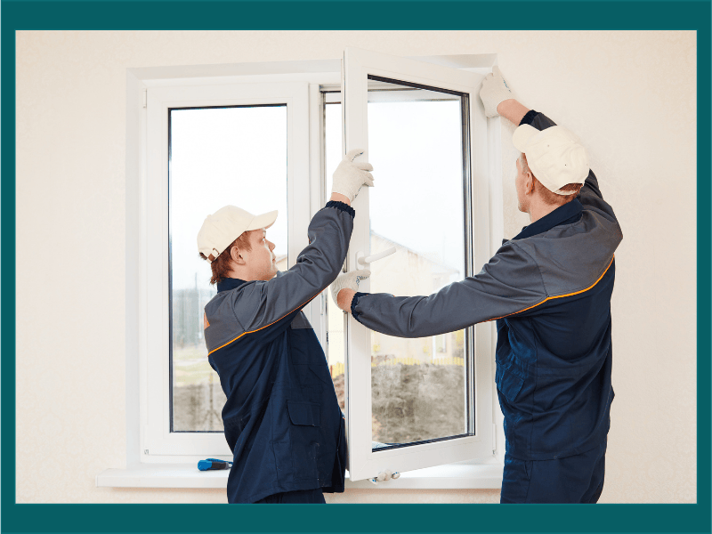 Technicians installing energy-efficient vinyl windows to improve home insulation and reduce energy costs.