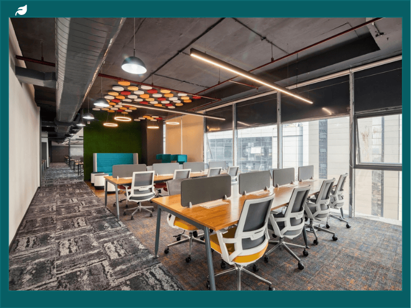 Modern office with colorful ceiling panels.