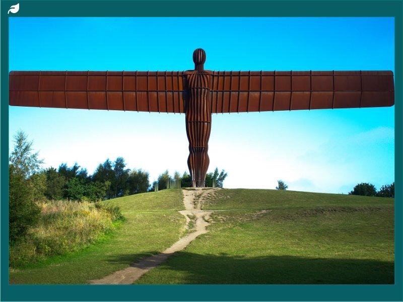 Rusted steel Angel of the North statue with wide outstretched wings