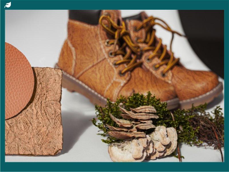 Vegan leather boots with mushroom material samples, moss, and bracket fungi