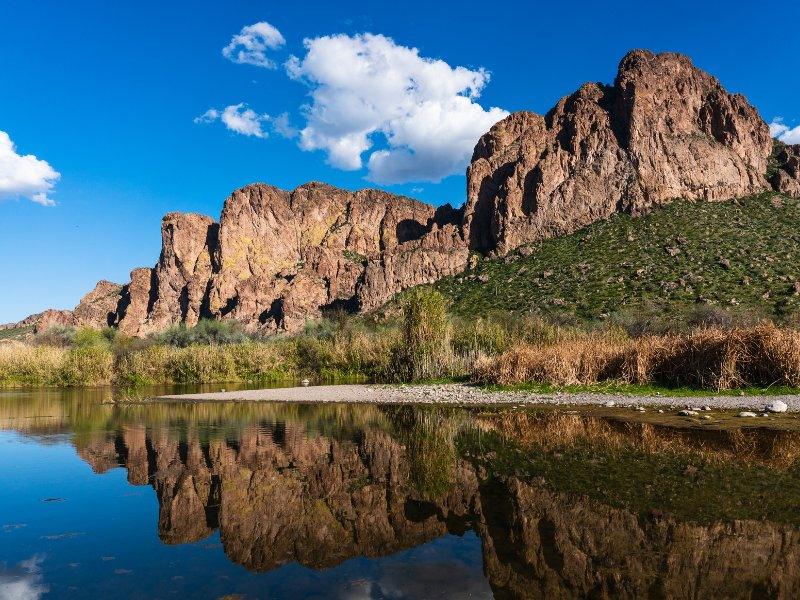 Rocky bluffs reflected in the Salt River near Mesa, Arizona