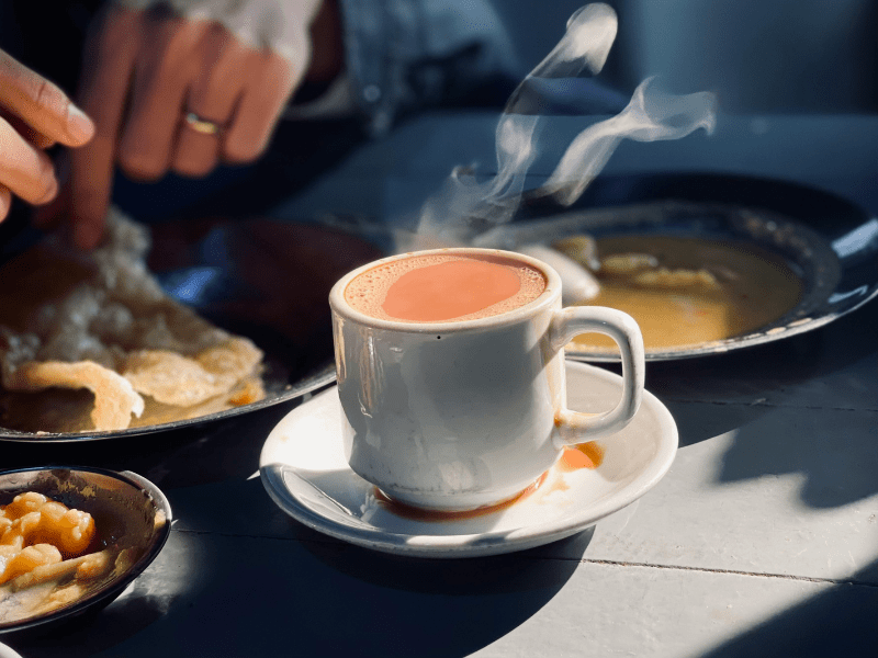 Pouring Chai Tea into a Glass