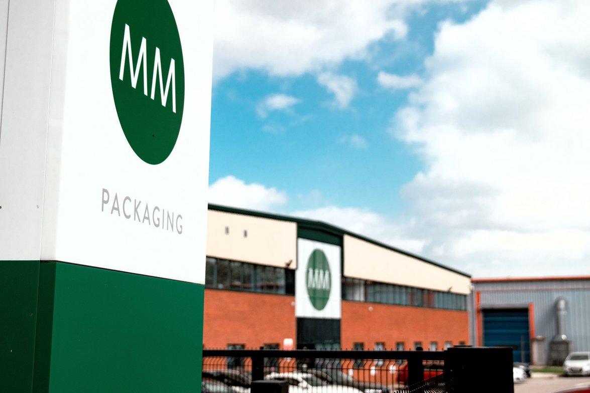 MM Packaging Deeside facility sign and building under a blue sky