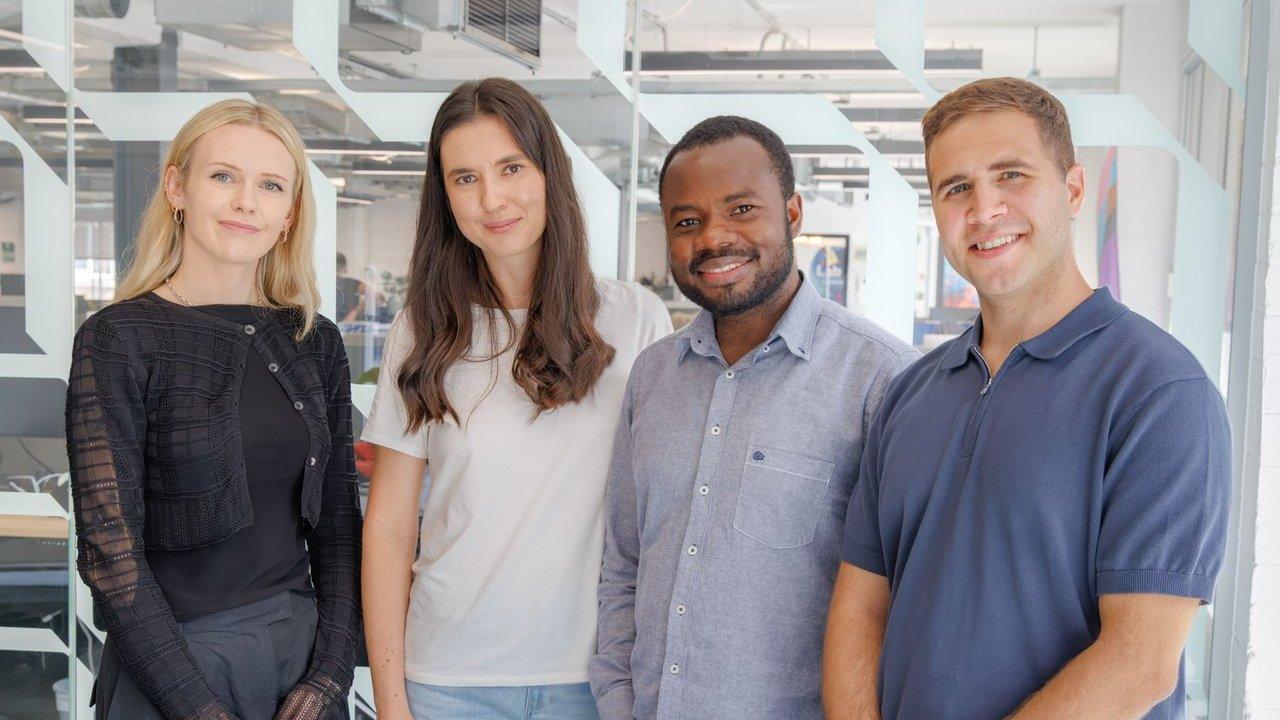 L-R: Caitlin Byrne, Adelya Khayrova, Emmanuel Asare and Rayan Osseiran standing in an office.