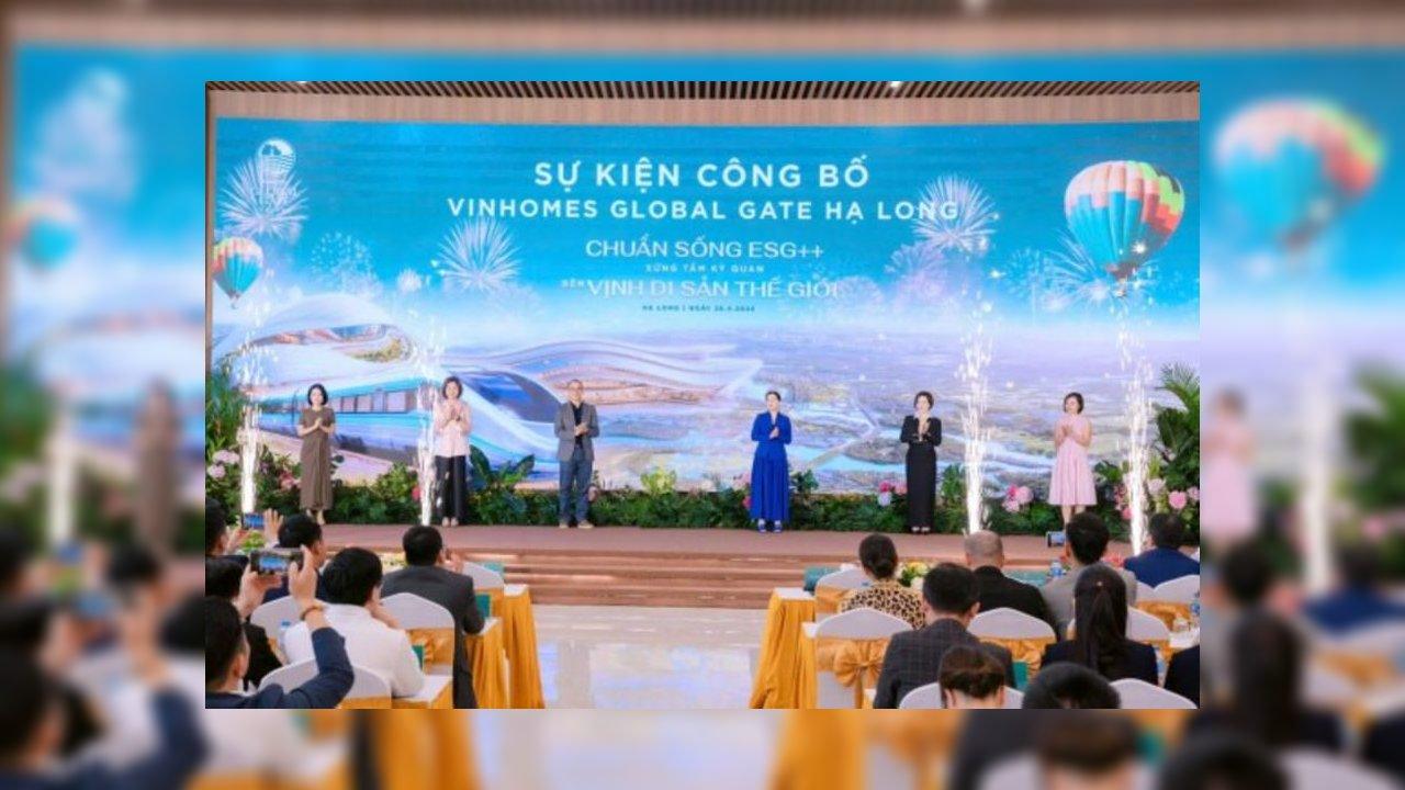 Speakers on stage at the launch ceremony of Vinhomes Global Gate Ha Long with cityscape screen and audience.