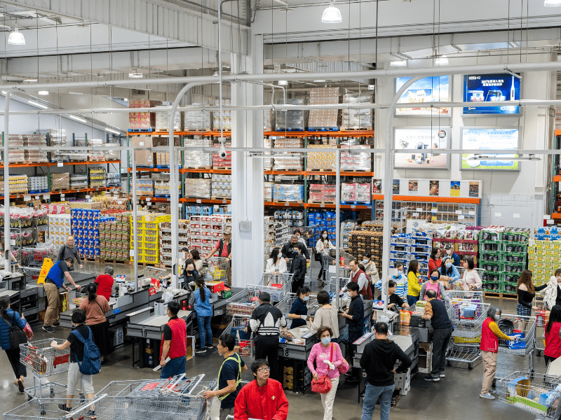 Shoppers at the checkouts inside a Costco warehouse store