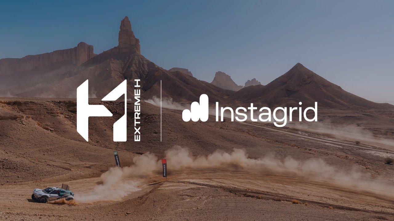 An off-road racing car kicks up dust in a desert landscape with mountains in the background, featuring "Extreme H" and "Instagrid" logos.