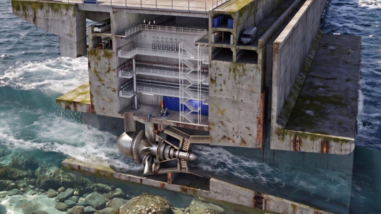 Cutaway of a tidal power turbine inside a concrete sea barrier with parked cars above.