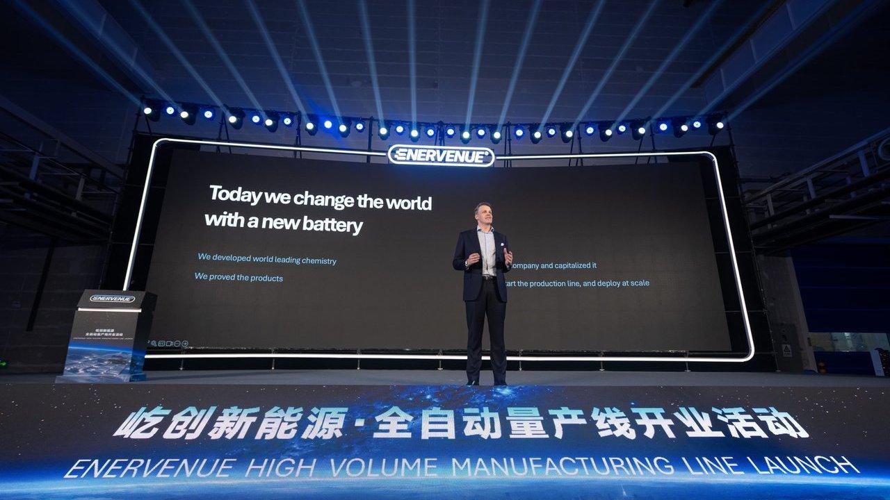A man speaks onstage at EnerVenue’s high-volume manufacturing line launch.