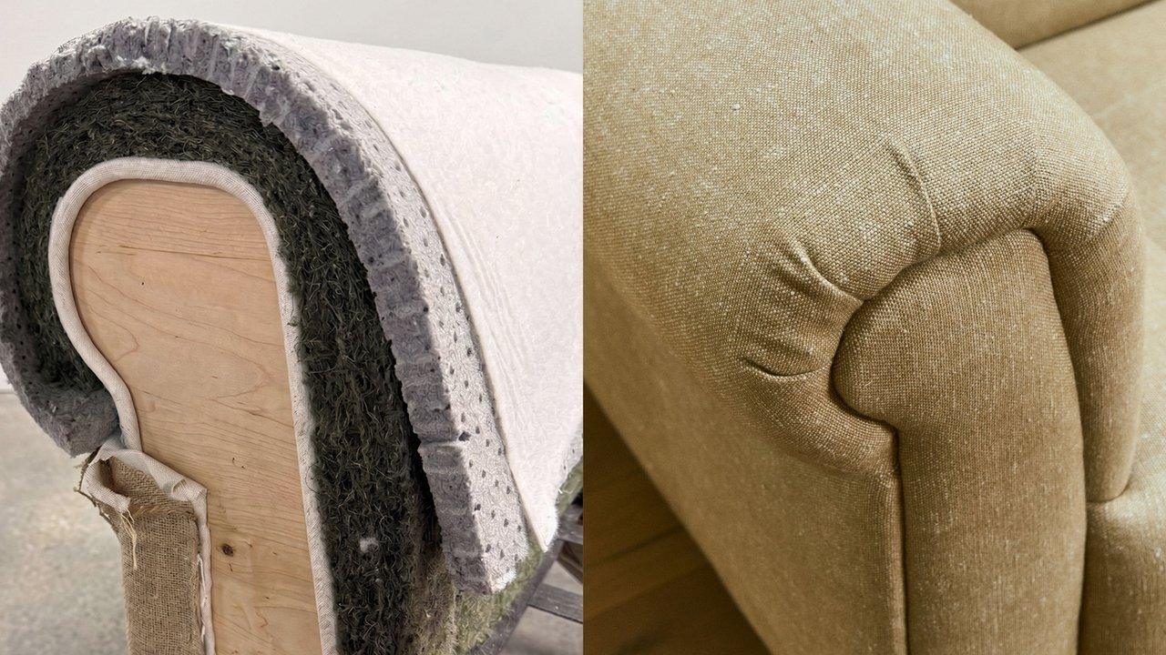 Cutaway of upholstered sofa showing layered padding and beige fabric armrest upholstery