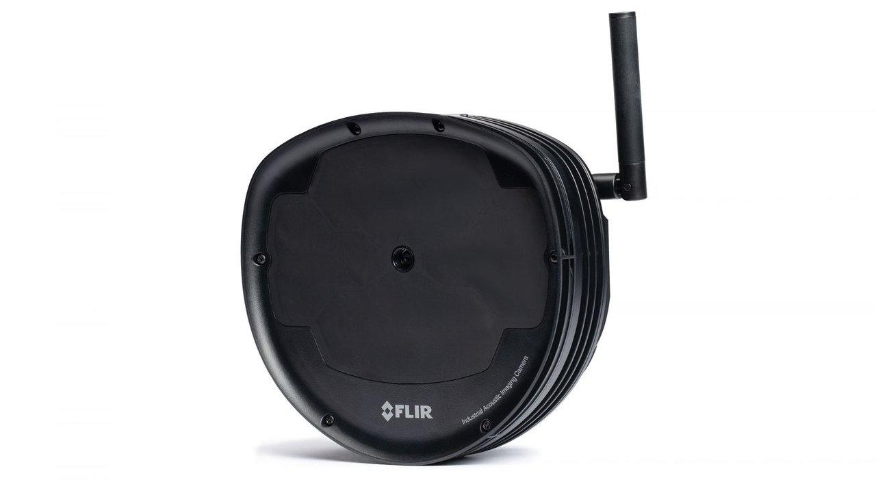 Black FLIR industrial acoustic imaging camera with an antenna on a white background