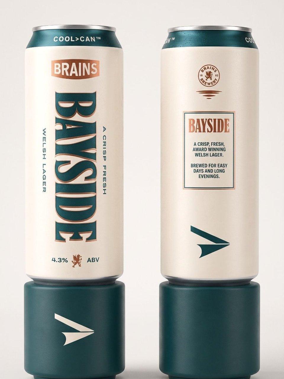 Two Brains Brewery Bayside Welsh lager cans displayed on teal cylindrical stands.