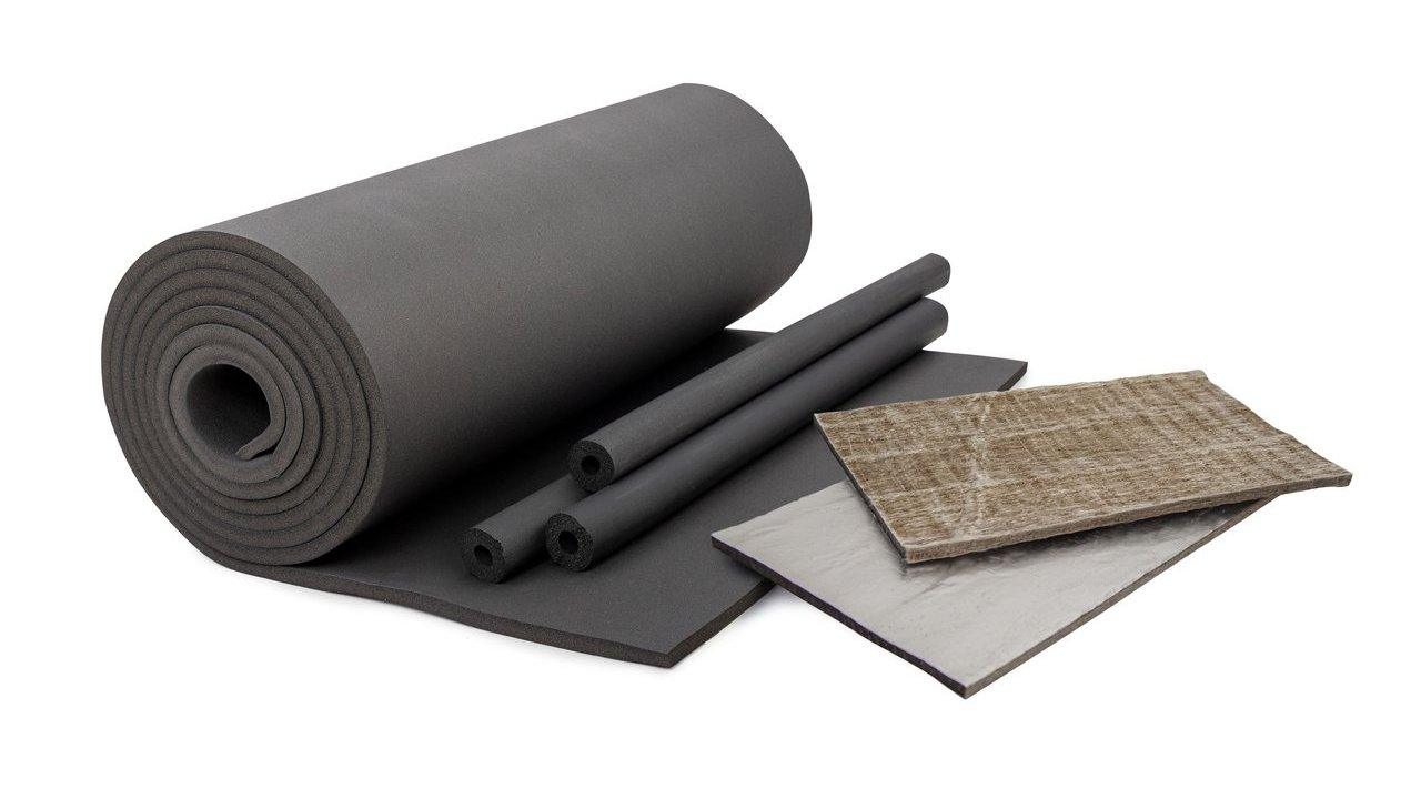 Rolls, sheets and tubular pieces of black insulation beside layered brown and silver insulation panels.